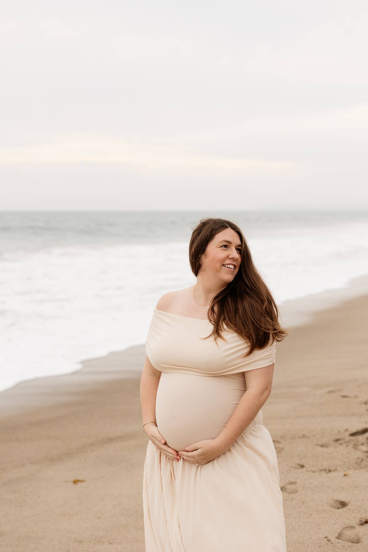 Brooke outdoors in a neutral dress